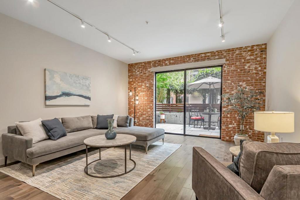 Welcome to Plant 51where historic charm meets modern luxury. A must see rare Luxury Condo Lifestyle; 2 Beds | 2 Baths | 1,275 SF + Private Patio perfect for relaxation. Smart layout with bedrooms on opposite sides ideal for privacy & comfort! Amenities: Bike Room; Gym/Exercise, Peloton equipment and Yoga Room facilities; Dog Run; Fire Pit enjoyment and BBQ Dining area and more! Movie Nights on the Deck! Near Cal-Train for commuting; Park; Whole Foods Grocery; A favorite must try Greenlees Bakery! Step inside to find exposed brick accents that echo the building's heritage creating a warm and inviting ambiance. This rare, ground-floor unit is move-in ready! Open-concept layout; newly upgraded modern finishes designed kitchen featuring high-end Jenn Air appliances. Both bathrooms include frameless glass showers and premium finishes. Stylish laminate flooring flows throughout, complemented by California Closet systems and remote-control window shades. Freshly painted! Steps from tandem garage parking and EV charging; business/game center w/Billard lounge; Beautifully landscaped common areas. Live in one of San Joses most desirable and vibrant communities! Balcony units are constructed with metal. SB 326/SB721 is not affected at this complex.