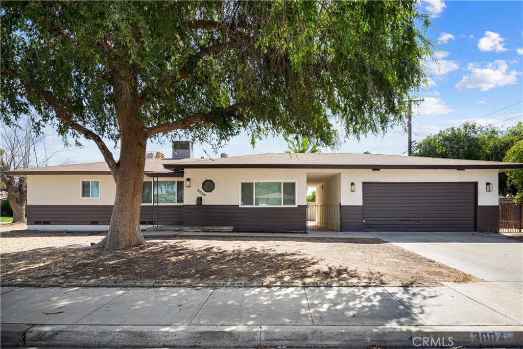 Welcome to 3004 S I St! Recently renovated to ease your move into the fastest growing city in California. Come and take a look for yourself, this home is spacious and versatile gem sitting proudly on a corner lot! This split-wing floor plan is perfect for multigenerational living, offering separation and privacy for extended family, guests, or even a potential rental setup. Enjoy the charm of a detached garage, ideal for storage, a workshop, or possible ADU conversion. With easy freeway access and nearby shopping, this home blends comfort, space, and convenience.
