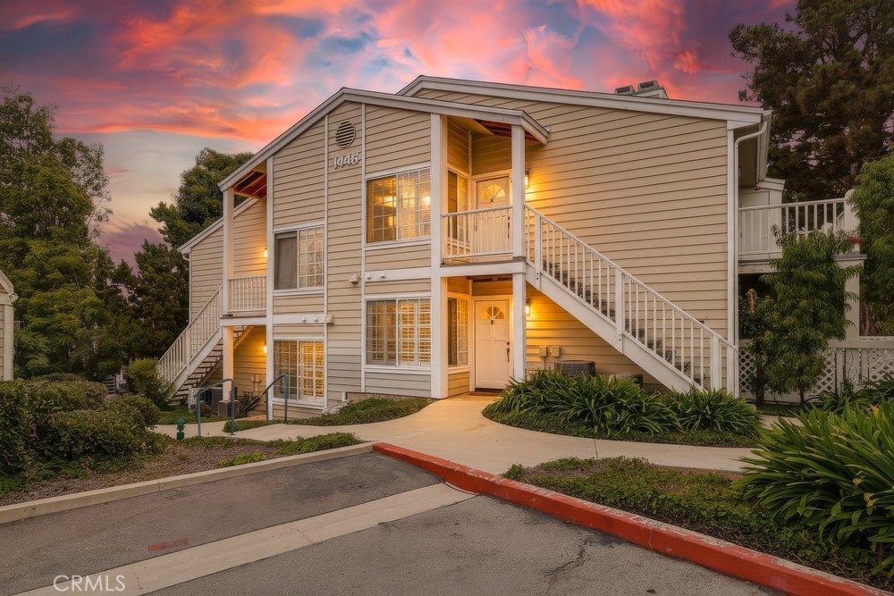 Enjoy a low-maintenance carefree lifestyle with this impeccably upgraded and move-in ready lower unit nestled amongst the mature landscaping that is a signature feature of the Harbor Gate North community. Spacious living area features an attractive fireplace with custom granite surround and sliding doors that open up to the wonderful private patio that is plenty large enough for weekend barbecues or just relaxing with a glass of wine after a hard days work. Attractive wide-plank vinyl flooring has just been installed throughout the living room, dining area, kitchen and hallway with plush low-ply carpeting warming up both bedrooms. Tastefully remodeled kitchen has been opened up to be more accessible to the living area and features custom white cabinetry, luxurious granite counters & backsplash, stainless steel appliances and a breakfast bar that has been altered to finish at the same heiight as the counters to create a more functional space. The sunlit dining area is perfectly located with easy access to both the kitchen and living area. Located at the end of the hall is the spacious primary suite that includes a walk-in closet and a nicely upgraded full bath. Second bedroom makes for the perfect guest bedroom, office or nursery and is located near the nicely upgraded hall bath that includes access to the conveniently located indoor laundry room. Additional interior amenities include fresh paint, recessed lighting and plantation shutters. Harbor Gate North is one of the few condominium complexes at this price point that offers a large PRIVATE two car tandem garage. With this particular unit the garage is in very close proximity to the unit so it's even more of a bonus.That's right, no common area subterranean parking to deal with on this one but there is plenty of guest parking for friends and relatives. No time to take a vacation? No worries, the cascading waterfalls and lush greenery that frame the community pool and spa area create a resort-like atmosphere that will make you feel like you're on vacation year round. This community is also in a very walkable location with grocery shopping, dining, banking and movie theatres only a few blocks away. For those who do still commute to work, there is quick and easy access to the freeways. If you're looking for a place you can move right into and immediately start enjoying the benefits of the lifestyle it offers, this unit is the one for you. HURRY!!