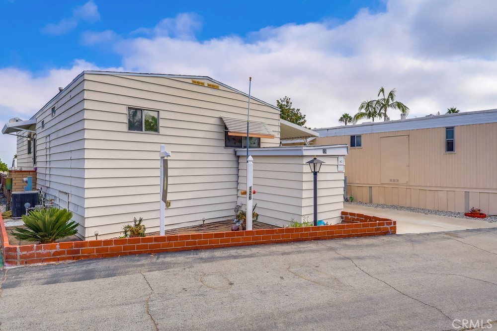 Buyers with vision & investors look no further. Great priced 2-bedroom, 2-bathroom home in the all ages Skyline Mobile Park offers Views! This charming cosmetic fixer is located on a scenic hillside offering breathtaking views of the entire South Bay—from snow-capped mountains to the Los Angeles Basin to the city skyline. Enjoy panoramic views from back patio, den, living room & dining area. Living room offers laminate floors, recessed lights, double doors leading out to back porch & striking views of the mountains & South Bay basin. Den has jaw-dropping views, storage & 2nd refrigerator. Kitchen has appliances including refrigerator w/built-in ice maker & water, oven, built-in microwave, tile floors, breakfast bar, & walk-in pantry-closet w/built-in cabinets. Dining area offers recessed lights, space for large table & captivating views! Primary bedroom pours in natural light & comes w/low-maintenance laminate floors, large closet w/mirrored sliding closet doors & built-in cabinets, plus bathroom ensuite. Primary bathroom comes w/walk-in shower including convenience seat & grab bar. Guest bedroom offers excellent storage space w/wall-to-wall closets & mirrored sliding closet doors, plus built-in cabinets & easy-care laminate floors. Guest bathroom offers walk-in bathtub/shower combo w/convenience seat, tiled walls & easy-care tile flooring. Laundry room located in shed w/washer & dryer included! Central A/C & Heat, Smart Honeywell thermostat controlled from your phone or manually, security Ring camera/doorbell, & Ezviz surveillance/video monitoring can be found in this one-of-a-kind home. Exterior yards located in front & back w/low maintenance landscaping. Carport fits 2 cars comfortably & is lined with solar lights for security's sake, plus stone paved steps. Extra storage located underneath home. NO Property Tax! Home in excellent school district near Whole Foods, Trader Joe’s, Starbucks, banks, AMC theatre, restaurants, medical centers, golf courses, beaches & freeways. Skyline Mobile Community boasts an abundance of amenities: community room, rec center, pool, hot tub, billiards, shuffleboard, library, kitchen, darts, putting greens & on-site manager. Monthly events include pool exercise, yoga, poker, line dancing, karaoke, folk guitar, tai chi, Bingo, etc. This gem resides in an excellent location & offers amazing views! With some TLC, this could be your dream home!