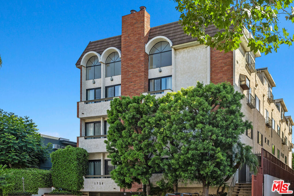 Tucked away on a peaceful, tree-lined street just blocks from the lively energy of Sawtelle, this beautifully updated top floor penthouse offers the perfect blend of modern style and urban convenience. Spanning 1,895 square feet, the light-filled 2-bedroom, 2.5-bath home features soaring ceilings in the main living room, framed by oversized windows and new sliding glass doors that create an airy, open feel. The kitchen is a cook's dream with brand-new sleek quartz countertops and top-tier appliances, seamlessly connected to a sunlit dining room ideal for relaxed family dinners or hosting friends. The primary suite is a private retreat with its own spa-like ensuite bath, as well as an in-unit washer and dryer, while the upstairs bedroom, also with an ensuite, works beautifully as a guest room, home office, or personal hideaway. Step out onto your expansive private rooftop patio perfect for morning coffee, evening wine, or watching the sun set over the city skyline. Additional perks in this ten-unit boutique building include two tandem parking spaces with direct entry from the gated garage for convenience and security. Just minutes from some of LA's best restaurants, shopping, newly renovated community center, YMCA and freeway access. This is your chance to own a stunning home in one of the city's most coveted neighborhoods.