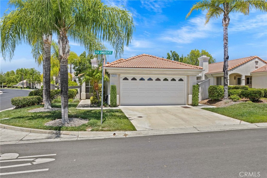 Welcome to this 3-bedroom, 2-bath home with optional office area, offering 1263 square feet of comfortable living space, ideally situated on a corner lot that backs to a peaceful greenbelt in the highly desirable Colony 55+gated community in Murrieta. This single story floor plan offers an inviting open-concept layout featuring a cozy living room fireplace, shutters and durable laminate flooring throughout. The kitchen provides generous cabinetry and counter space, perfect for both everyday meals and entertaining. The primary suite includes a walk in closet and private bath, while the additional bedrooms offer versatility for guests, and office or hobbies. Step outside to a private backyard retreat with no rear neighbors-enjoy serene greenbelt views and privacy, and premium corner lot. Residents of The Colony enjoy vibrant, resort-style amenities such as a championship 18-hole golf course, clubhouse, swimming pool and spa, tennis and pickleball courts, fitness center, and a wide range of social activities. The HOA maintains front yard landscaping and provides 24-hour guarded gate security for worry-free living. This home offers the perfect blend of comfort, privacy, and active adult living in one of Murrieta's most sought-after 55+ communities.