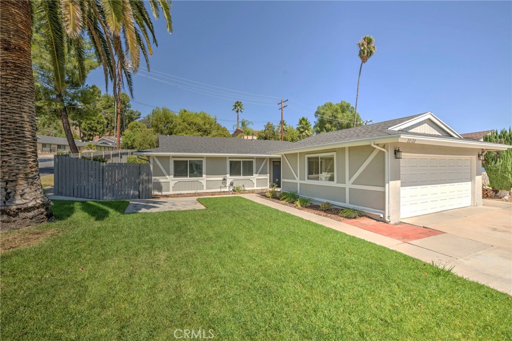 Welcome to this charming corner-lot home in the heart of peaceful Santa Clarita! From the moment you arrive, you’ll be greeted by a vibrant, lush green lawn and a home that shines with upgrades inside and out. Step into the living room featuring new flooring, flowing seamlessly into the fully renovated kitchen. The kitchen boasts stylish white shaker cabinets, stainless steel appliances, a crisp subway tile backsplash, newer countertops, and updated plumbing fixtures—perfect for the modern chef. A spacious adjoining dining area makes hosting friends and family a breeze. Both bathrooms have been tastefully upgraded with classic vanities, tile flooring, re-tiled showers, and newer plumbing and lighting fixtures. The bedrooms are bright and airy with ample closet space, plush carpeting, and plenty of natural light. This home is loaded with upgrades, including **newly painted interior, updated windows, newer AC and heating units, an upgraded roof, updated rain gutters, upgraded electrical panel, backyard water pump, and a full security system surrounding the property** for added peace of mind. Outside, enjoy your private oasis—complete with a pergola ideal for outdoor dining, entertaining, or relaxing in the sunshine. Surrounded by tall trees, the backyard offers ample space for gardening or colorful flower beds. Additional highlights include an attached two-car garage and a prime location close to Central Park, hiking trails, dining, entertainment, and more. This Santa Clarita gem truly has it all—don’t miss your chance to make it yours!
