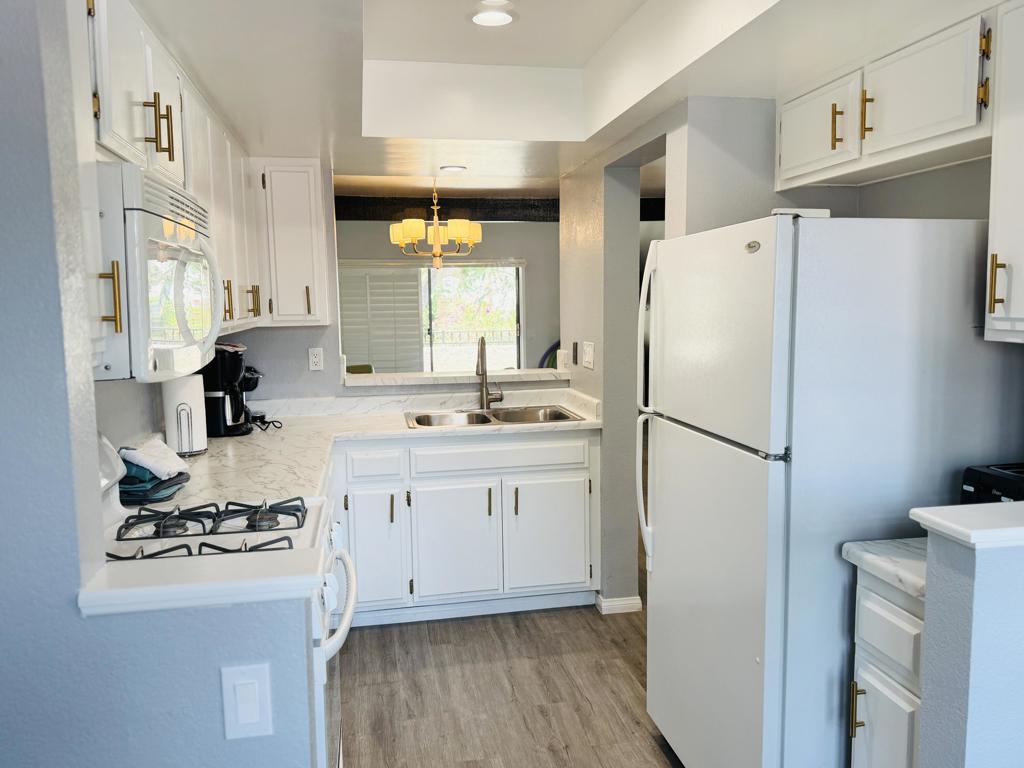 Desert Escape or Investment Opportunity - Modern 2 Bed / 2 Bath Condo in Prime Location!Looking for the perfect warm-weather getaway, a full-time residence, or a smart vacation rental? This beautifully updated 2-bedroom, 2-bath upstairs condo offers the flexibility and lifestyle you've been dreaming of.With 1,225 square feet of modern living space, this light-filled condo features two spacious master suites--each with its own newly remodeled private bathroom--ideal for comfort and privacy. The open floor plan boasts vaulted ceilings, a large kitchen with brand-new quartz countertops, a cozy breakfast nook, and a private balcony with lush mountain views--a serene spot for your morning coffee or sunset glass of wine.This unit also includes a one-car garage, perfect for secure parking or extra storage.Located in the prestigious, gated Oasis Resort, this Spanish-style community is nestled on 27 acres of manicured desert landscaping directly across from the iconic Parker Hotel. Amenities are unmatched, including:8 heated swimming pools & 9 hot tubs5 tennis courts, pickleball, bocce ball & basketball courtModern fitness center & clubhouseOnsite property management, landscaping & maintenanceAmple free guest parkingRecent upgrades include fresh exterior paint (2025) and roof replacements within the last 5 years.HOA dues cover nearly everything--water, trash, sewer, exterior maintenance, landscaping, earthquake insurance, all amenities, and more (you only pay gas, electric, and Wi-Fi).Whether you're seeking a peaceful escape, a stylish full-time home, or a turn-key rental property, this condo at Oasis Resort checks every box.Schedule a private showing today and make this desert oasis yours!