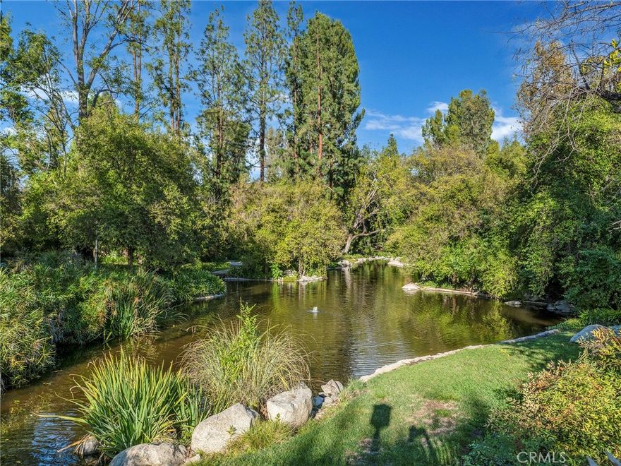 Welcome to Canoga Lakes! This charming Condo offers a tranquil, resort-like living experience with serene lake views, lush landscaping, and towering trees. Nestled within a peaceful community, enjoy the calming sights and sounds of waterfalls, streams, and wildlife, including ducks, turtles, and koi fish. The expansive grounds feature two sparkling pools, a spa, tennis courts, a recreation room, and a fitness center, offering a variety of amenities to enhance your lifestyle.  This spacious 1-bedroom, 1-bath condo, features vaulted ceilings with an extra large loft. The living room opens to an extended patio overlooking the pool, providing the perfect space to relax and enjoy the serene surroundings. The unit is updated with newer flooring,  updated kitchen, stainless steel appliances, including a stove, dishwasher, wine fridge, Updated Bathroom, Other notable features: a large attic for extra storage, and an in-unit washer/dryer. Located within walking distance of shopping, dining, and the Warner Center business district, this condo offers the perfect balance of peaceful living and convenience. One assigned parking spot is included. Come experience the relaxing atmosphere of Canoga Lakes, a place you'll love to call home!