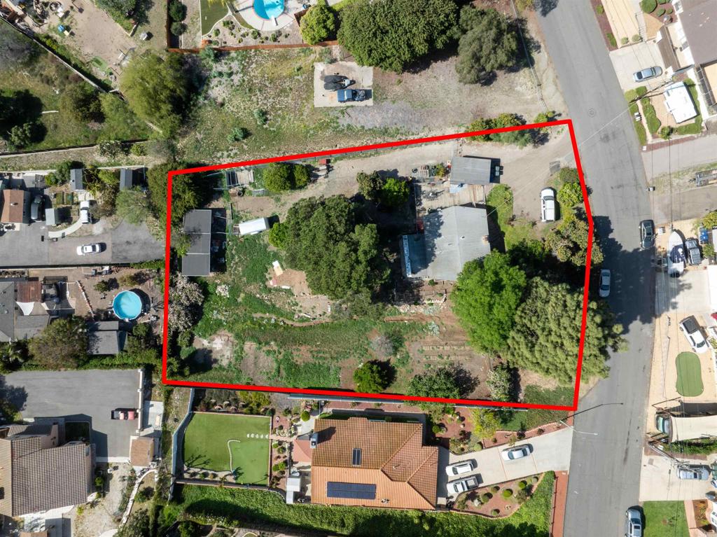 Diamond in the rough! Unique floor plan in desirable neighborhood. Needs TLC. Some hardwood, tile & vinyl wood floors, ceiling fans, vaulted ceiling, fireplace, 2 bd & 1 bath up, 1 bd & 1 bath down, Laundry up -stackables and full size W & D laundry down Included . Extra sq ft down as big family room. Sold "as is". Could possibly work as a duplex! Huge deck, mature fruit & shade trees. Horse property, fertile garden and lots of potential! County will allow lot to be divided into 3 lots. The lot is.75 acre so lots of room for making your dreams come true!