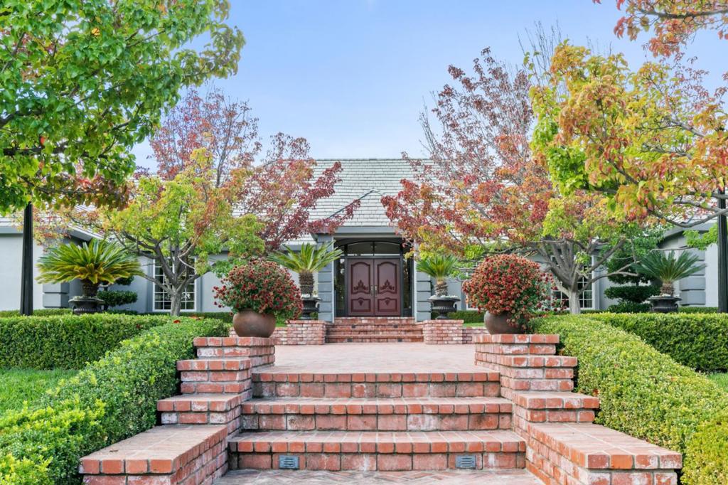 Exquisite estate in the tranquil boutique town of Monte Sereno. Perfectly set for enjoyment on a flat lot with manicured landscaping, sparkling pool, tennis court & beautiful gardens. Stately curb appeal with circular Slate driveway & extensive brick-work. Totally remodeled home features charming light-filled spaces, floor to ceiling windows throughout, foyer w/barrel ceiling & grand living/dining/family rooms. Open gourmet kitchen with triple crown moldings, box tray ceiling, custom solid wood inset cabinetry, large island, Wolf range, Sub-Zero refrigerator, built-in coffee maker, pantry & breakfast nook. Large primary suite w/coffered ceilings, marble bath with jetted tub & shower, large walk-in closet with built-in wardrobe. 2 junior suites, separate wing/in-law quarters, large office with double door entry, exercise room, 3 Car garage. Outdoor kitchen. Located close to downtown Los Gatos, La Rinconada Country Club, award-winning Los Gatos Schools