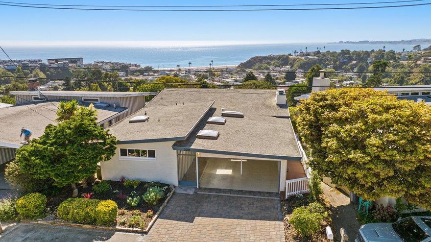 Coastal luxury with unparalleled ocean views at 220 Shoreview Drive, an extraordinary Aptos retreat where unobstructed Monterey Bay views define your lifestyle. Just steps from Rio Del Mar beach, this 4-bedroom, 2-bathroom, 2450 sq ft haven blends elegance with the allure of the sea. Savor panoramic vistas from the sunlit deck or through expansive windows in the open-concept living area. The brand-new Chefs kitchen, featuring Cambria quartz countertops and stainless-steel appliances, overlooks the ocean and flows seamlessly into dining and living areas warmed by a marble fireplace. A versatile floorplan offers potential for a separate downstairs unit, ideal for guests or rental income. Enjoy proximity to Seacliff beach, Pleasure Point's surf breaks, and popular local restaurants. 220 Shoreview Drive isn't just a homiest a lifestyle defined by the Pacific. Schedule your private tour today.