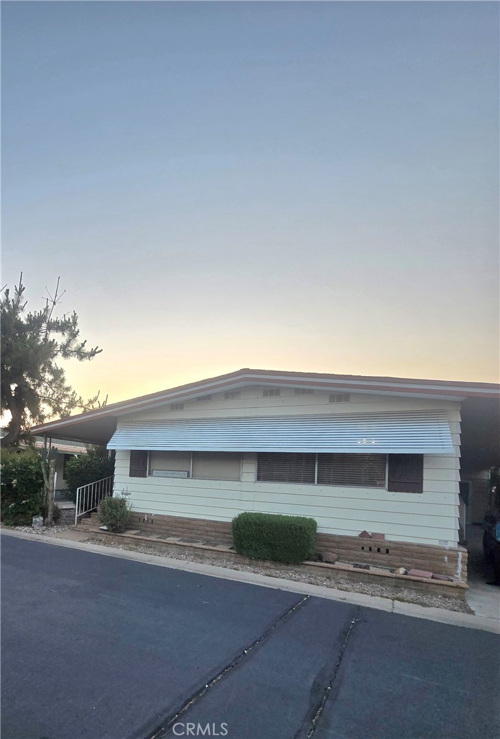 Nice large mobile home with 2 very large bedrooms and 2 bathrooms. House is equipped with lots of storage space which includes a enclosed patio, a extra enclosed storage area and a storage area outside. Home has a large living room, family room, dinning area and kitchen. Laundry room also inside which is a plus. You have a large awning on side to park your vehicle and across the way 3 parking stalls available for your visitors.