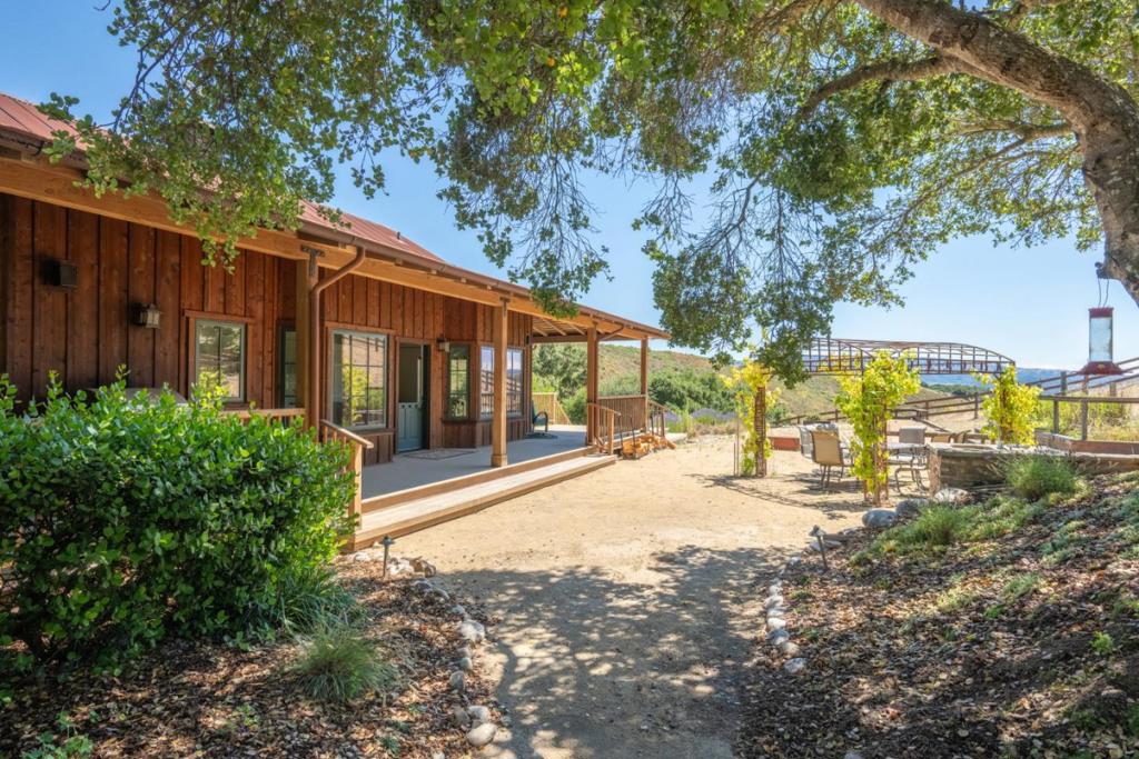 This stunning ~129-acre oak-studded ranch located in the exclusive gated community of Quintana Ranches in Carmel Valley offers seclusion and serenity just minutes from all of Carmel's amenities. The property includes a 3-bed, 2-bath cottage and an event barn with a 2-bed, 1-bath caretaker's apartment with loft. The 3,200 SqFt workshop/garage/recreational space of the barn is ideal for hobbyists, entertainers, or car enthusiasts. Enjoy beautiful views from the 360 degree deck around the cottage or from the outdoor activity area featuring bocce ball, horseshoes, a fireplace, and raised beds. A small corral/stables for horses or livestock, on-property hiking trails, and a main home site with preliminary architectural layout drawing for a custom 4,000 SqFt home provide further, developable potentials for a lucky buyer. This offering is a rare opportunity to build a legacy ranch-estate in one of the most beautiful and sought after locations in Carmel Valley.