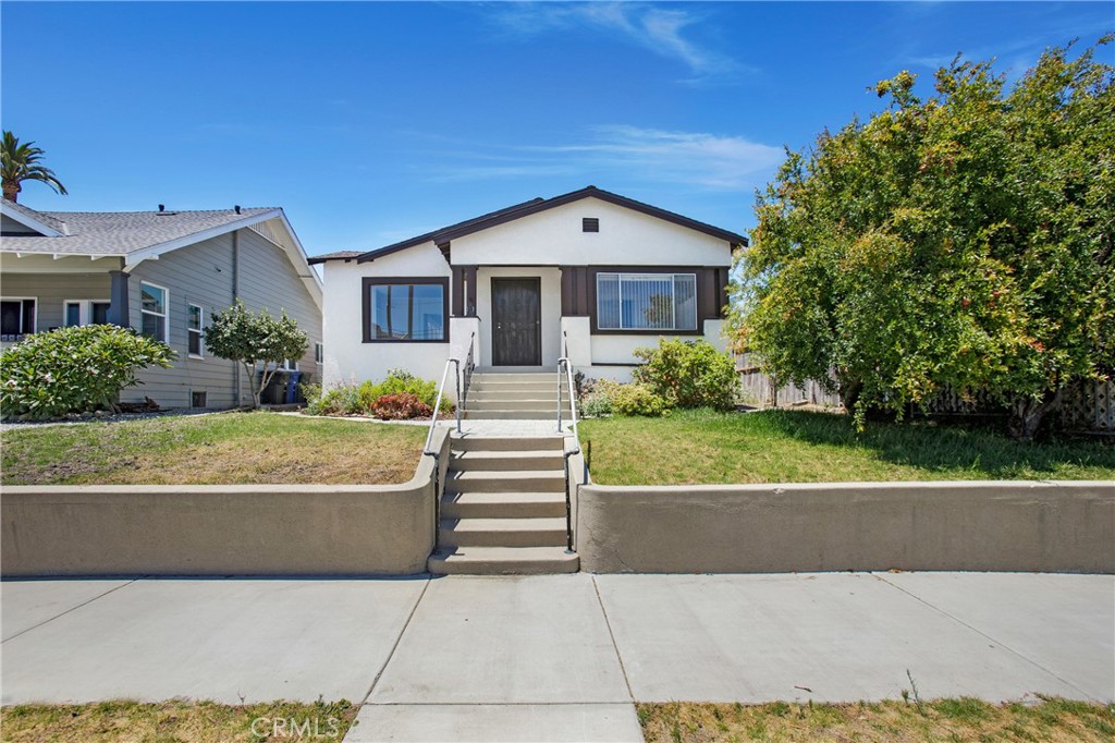 This spacious single-level home in the heart of San Pedro blends classic charm with flexible living space and thoughtful improvements. With 1,935 square feet of living space, this 3-bedroom, 2-bath home also includes a 2-car attached garage and large bonus room with stone fireplace, wet bar, and closet—perfect as a primary suite, family room, or fourth bedroom. You’ll find original character throughout in the preserved vintage details such as crystal doorknobs and copper light fixtures. The open floor plan connects the living, dining, kitchen, and a versatile flex space ideal for a home office, walk-in pantry, playroom, or future kitchen expansion. Additional highlights include new carpet in the bedrooms and living room, new blinds throughout most of the home, and LVP flooring in the kitchen, dining, bath and laundry areas. The spacious indoor laundry room offers direct access to the outside. 2-car attached garage with opener, two full bathrooms—one with separate tub and shower and the other with walk-in shower. Peek-a-boo views of the water-port and Vincent Thomas Bridge from the living room’s picture window complete the layout. New water line from the city valve to the home has also been installed, adding to the property’s value. Zoned LCC2YY, this property also presents intriguing possibilities for future use—buyers are encouraged to verify zoning if interested with City of LA. Whether you’re seeking a single-family home or an investment property, this inviting residence offers charm, space, and potential in a desirable location. And with the highly anticipated West Harbor waterfront redevelopment just minutes away—bringing 42 acres of new restaurants, shops, parks, and entertainment to the harbor—Don't miss this rare opportunity to be part of San Pedro’s growing and exciting future.
