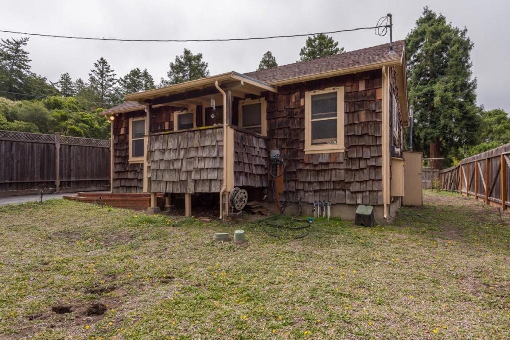 Solid well maintained home in an excellent part of the wonderful small town of La Honda. Two car garage with workshop. The seller has a generator panel installed to make back up power easy and safe. This place offers lots of possibilities and is in a very livable condition.