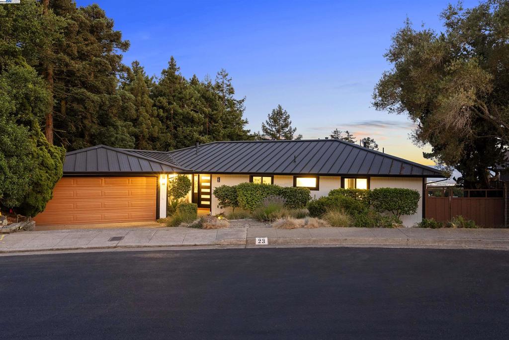 Welcome to this stunning modern 3 bedroom, 2.5 bathroom home that has been tastefully and thoroughly renovated from top to bottom—with all work completed with final permits. From the moment you arrive, you'll notice this home's standout curb appeal and sweeping views! Inside, the living areas feature beautifully refinished hardwood floors, while all bedrooms have brand new fresh flooring. As mentioned, enjoy sweeping views from windows throughout. Every detail has been carefully considered, including fresh interior paint, exterior paint and new interior light fixtures to add to the home’s fresh and modern look. All bathrooms are completely renovated which offers consistency in quality and design throughout! The garage has been given a clean, finished look with fresh paint and fresh epoxy flooring. Both the front and back yards have been professionally landscaped, trimmed, and cleaned for easy maintenance and outdoor enjoyment. Also, this home resides on a HUGE almost 1 full acre lot (42,000+ sq ft)! You will absolutely fall in love with this beautifully renovated home with views that offer comfort, quality, and style in one complete package!