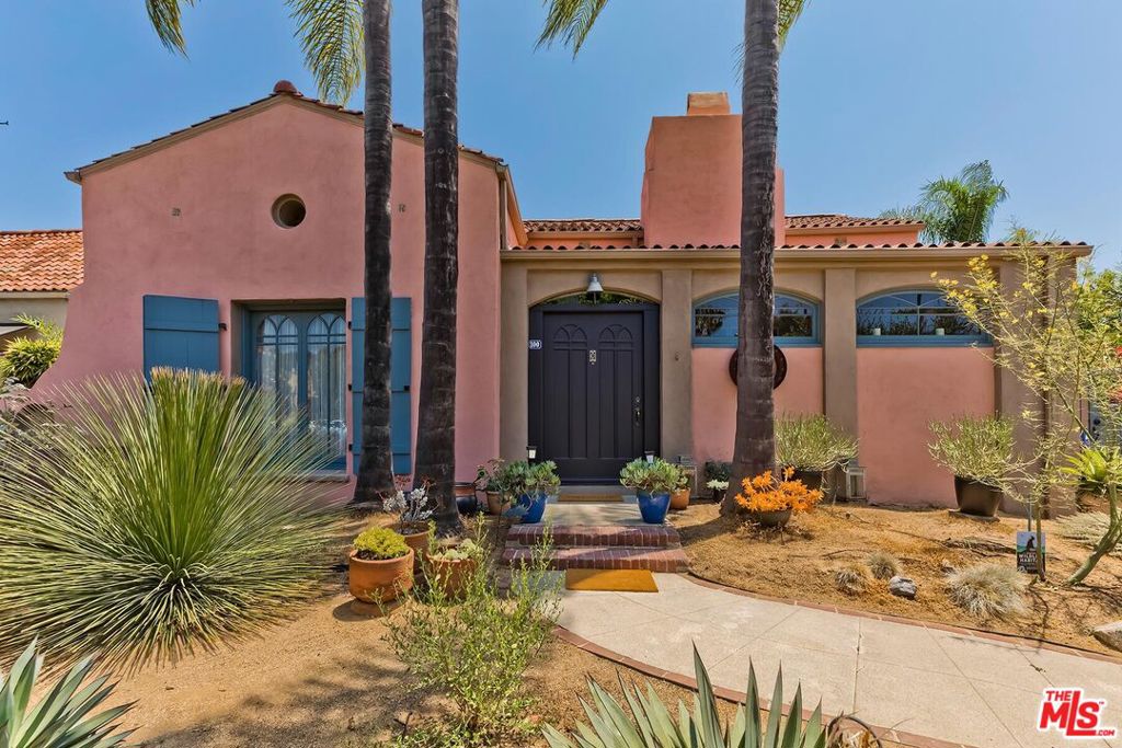 Originally designed by architect Harry S. Bradley and built in 1920 by Dr. Earl Moody, Casa Adobe is a rare gem of early California Mexican architecture. With only 2 owners, beautifully restored by interior designer Edwidge St. Jacques, Casa Adobe blends historic charm with modern updates. Located near Larchmont Village, the private, walled estate sits on a sun-filled corner lot with native landscaping, mature gardens, an outdoor patio, and a permitted fireplace perfect for indoor outdoor living. Inside, the classic adobe entrance leads to a tiled foyer, formal living and dining areas, a library/office, sun room and a remodeled kitchen. The main house offers 3 bedrooms, 2 baths, updated systems, a tankless water heater, cooling systems, 2-car garage, a California basement with a sump pump, and ample attic space. A fully furnished, income generating ADU, is at 5175 W. 1st Street. It features one bedroom, one bath, a full kitchen, washer/dryer, and a fabulous balcony and a private entrance. Situated in the 3rd Street Elementary School District and near The Marlborough School, Casa Adobe offers are rare opportunity to own a piece of Los Angeles history with modern comforts. CASA ADOBE ES UNA CASA MAGNIFICA!!