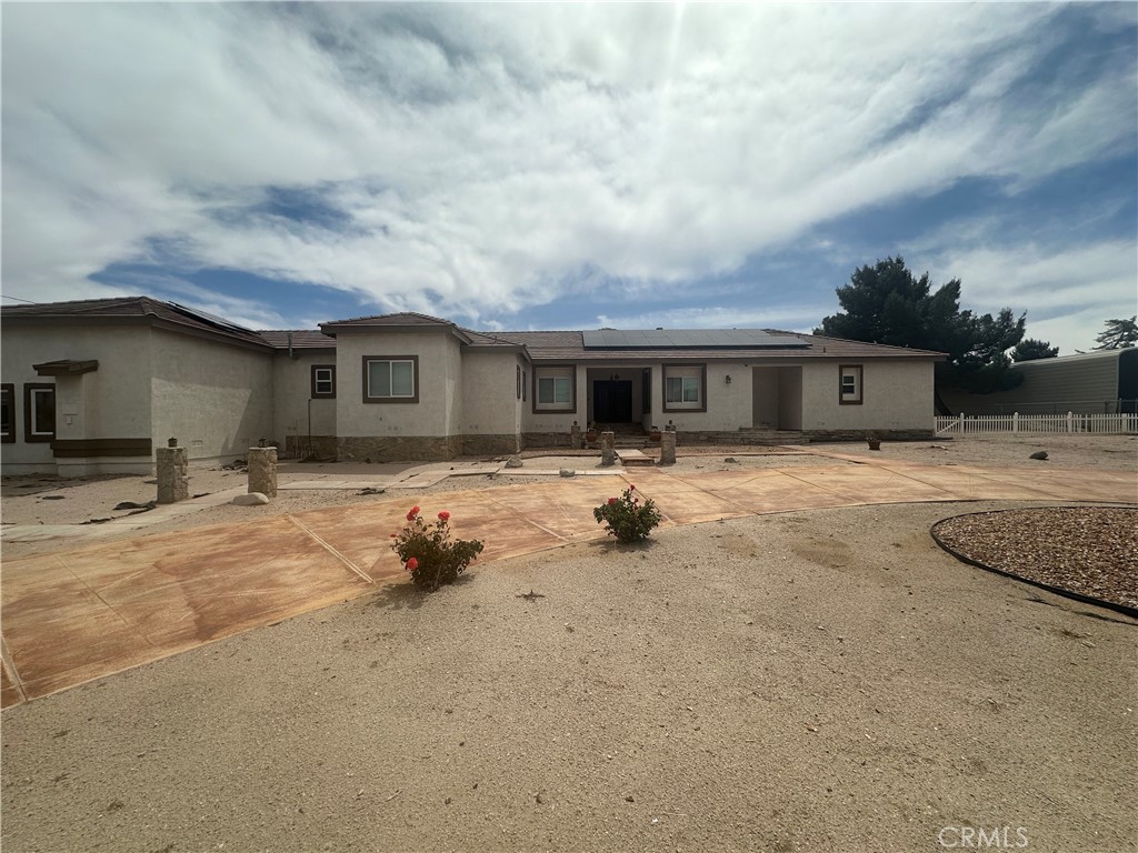 Price Improvement with a Motivated seller...Honey, stop the car! Come see this exquisite 5 bedroom 3 bathroom custom single story home with 3 wood burning fire places. Boasting over 3450 square feet. Kitchen includes custom cabinets, granite counter tops throughout the home, stainless steel appliances with double oven. Formal Dining and Living room with high ceilings, Extra large primary bedroom with private patio access that leads to the entertainers delight back yard with multiple covered patios and a lot size that is over an acre. Outdoor kitchen with stainless steel grill. Enjoy plenty of storage with the 3 car garage, RV access drive up and wrap around entrance. Close to schools, parks, and mall. Solar Panels included at $300 a month. Buyer to take over lease. Furnishings in the house and backyard are negotiable for sale. This house won't last long!!