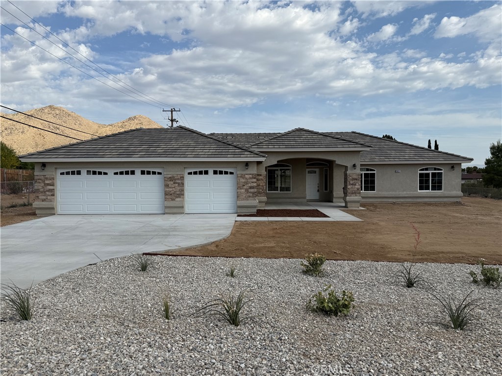 Be the first to enjoy this EXQUISITE NEW CONSTRUCTION home featuring 4 bedrooms and 2.5 bathrooms. The modern design highlights a seamless open floor plan, high ceilings, and fine finishes. Enjoy cooking in your well-appointed kitchen equipped with a water fall countertop island & large pantry, relaxing in the generous living areas, and retreating to your primary bedroom suite. Also, included is an indoor laundry room, a 3-car garage, and a covered patio. All of this on a large lot situated in beautiful Apple Valley, CA. Don’t miss out on this perfect blend of style and functionality! Solar is installed with the minimum standards as required by the state and the solar is owned.