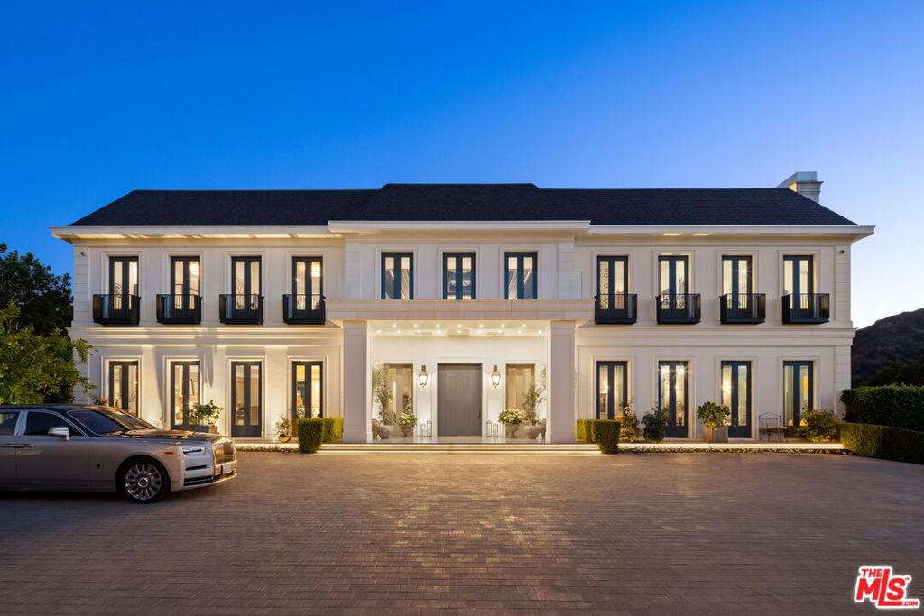 Recently renovated with the highest level of quality within the last 4 months and nestled in one of Beverly Hills's most exclusive and secure enclaves lies the magnificent Crestview Manor. Perched atop a five-acre promontory, this newly rebuilt and expanded masterpiece offers breathtaking views of the surrounding mountains, creating a serene backdrop for its unparalleled amenities. Privacy and security are unrivaled as the manor sits prominently behind double gates. Designed and constructed with impeccable taste, the estate seamlessly integrates today's cutting-edge technology with timeless elegance. Spanning approximately 46,000 square feet under roof and 38,000 square feet under air conditioning, the residence encompasses 12 bedrooms and 24 baths. A separate 5,000-square-foot guest penthouse, caretaker house, and two-bedroom guardhouse complement the main residence, while a spacious 12-car garage and parking for 80 vehicles accommodate the most discerning collector. An extraordinary indoor sports complex awaits, inviting residents to indulge in a passion for active living. The complex features basketball and pickleball courts, a fully equipped gym, a boxing ring, a sports lounge, and a bar. The grounds are adorned with a stunning zero-edge pool that artfully frames the expansive estate and its picturesque views, offering a haven of tranquility amidst lush surroundings. Conveniently located minutes from the prestigious Beverly Hills Hotel and just 20 minutes from Van Nuys private airport, this estate is accessible only through private, gated streets. Discover a life of unparalleled luxury and serenity at the Crestview Manor, where timeless elegance and modern convenience blend seamlessly in the heart of Beverly Hills.
