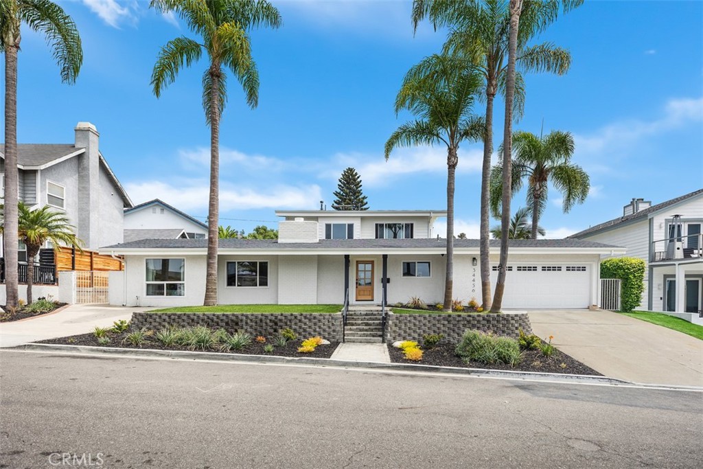 Welcome to an unparalleled sanctuary of luxury and elegance, nestled in the heart of the coveted coastal enclave of Capistrano Beach. This rare private residence offers the perfect blend of serene privacy and vibrant coastal living, ideally situated between the charming San Clemente beaches and the iconic Dana Point Harbor.
Completely reimagined from the ground up, this exquisite home showcases an artful blend of modern design and classic sophistication. As you enter, you're greeted by a grand and welcoming oversized family room that seamlessly transitions into the gourmet chef's kitchen and extends to the stunning backyard oasis. This culinary haven, equipped with premium appliances and adorned with designer touches, is perfect for entertaining and creating unforgettable memories with family and friends.
The main floor hosts three generously sized bedrooms, providing comfort and convenience, while the upper level is exclusively dedicated to the opulent primary suite. This tranquil retreat features a spacious sitting area, a lavish spa-like bathroom with a large soaking tub and a walk-in shower adorned with floor-to-ceiling subway tiles. The oversized walk-in closet offers ample storage and organization for your wardrobe.
Step outside to the redesigned private backyard, where a resort-style pool and spa invite relaxation and rejuvenation. Surrounded by lush greenery, a dedicated barbecue area, and a charming grass space, this outdoor haven is perfect for hosting family gatherings or enjoying tranquil moments under the sun.
From the large view deck attached to the primary suite, indulge in breathtaking ocean and sunset vistas that capture the essence of coastal living at its finest. This property is not just a home; it’s a lifestyle choice, offering proximity to world-class beaches and surfing, the historic San Clemente Pier, Dana Point Harbor, charming boutiques, wine bars, and luxurious shopping experiences.
Furthermore, this exquisite property is located within moments of award-winning blue ribbon schools, ensuring an exceptional educational experience for families. Embrace the epitome of coastal luxury living where every detail is curated to enhance your daily life and create lasting memories. Welcome to your dream home in Capistrano Beach.