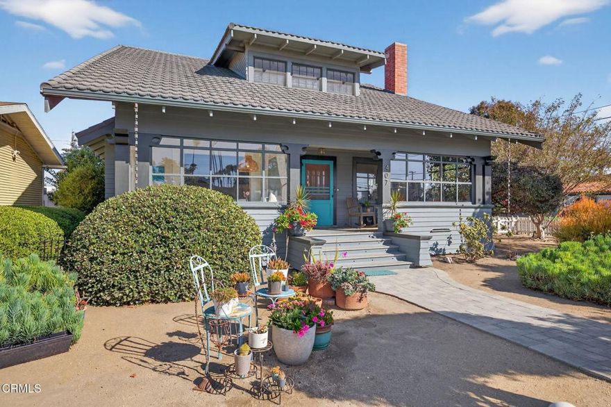 Enjoy the warmth and character of this beautifully remodeled 5-bedroom, 2-bath Craftsman home, perfectly situated on a large corner lot in Oxnard's historic district. Every detail has been thoughtfully restored to honor the home's original 1912 charm, blending classic craftsmanship with modern comfort. Inside, you'll find a bright and open living and dining area filled with natural light and warmth from the original hardwood floors. The remodeled classic kitchen, located in the heart of the home, perfectly captures the spirit of the era while offering modern functionality. Enjoy mornings in the sun-drenched sunroom, ideal for morning coffee, or relaxing in the evening with a good book. Two spacious downstairs bedrooms and a large, period-style bath offer convenience and comfort on the main level. Upstairs, you'll find three more generous bedrooms and another beautifully remodeled bath, each space bathed in natural light and offering ample closet storage. The large enclosed front porch with a swing welcomes you home and invites you to slow down and savor the neighborhood's charm. Outside, a beautifully landscaped yard surrounds the home, with a large backyard perfect for entertaining. A separate garage with alley access adds convenience, while a bonus backyard studio offers endless potential whether as a workshop, gardener's space, or artist's retreat. This home is a rare opportunity to own a piece of Oxnard's history. It has been lovingly restored and is ready for you to create new lasting memories.