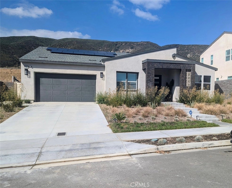 The Narra Hills gated community in North Fontana offers resort-style amenities, including a pool, jacuzzi, dog park, pickleball court, and a clubhouse. The development by Landsea Homes is located near the 15 freeway and is set against the backdrop of the San Bernardino National Forest. 
Specifically for 15814 Butterfly Drive, the property includes: A spacious, single-story home with 4 bedrooms and 3 bathrooms, built in 2023.
An open floor plan that connects a large kitchen island to a great room.  Luxurious interior details like elegant wainscoting and upgraded floors.  A master suite with a walk-in closet, dual sinks, and an upgraded bathtub.  A "California room" for enjoying sunsets and stargazing.  A large lot of over 12,000 square feet.