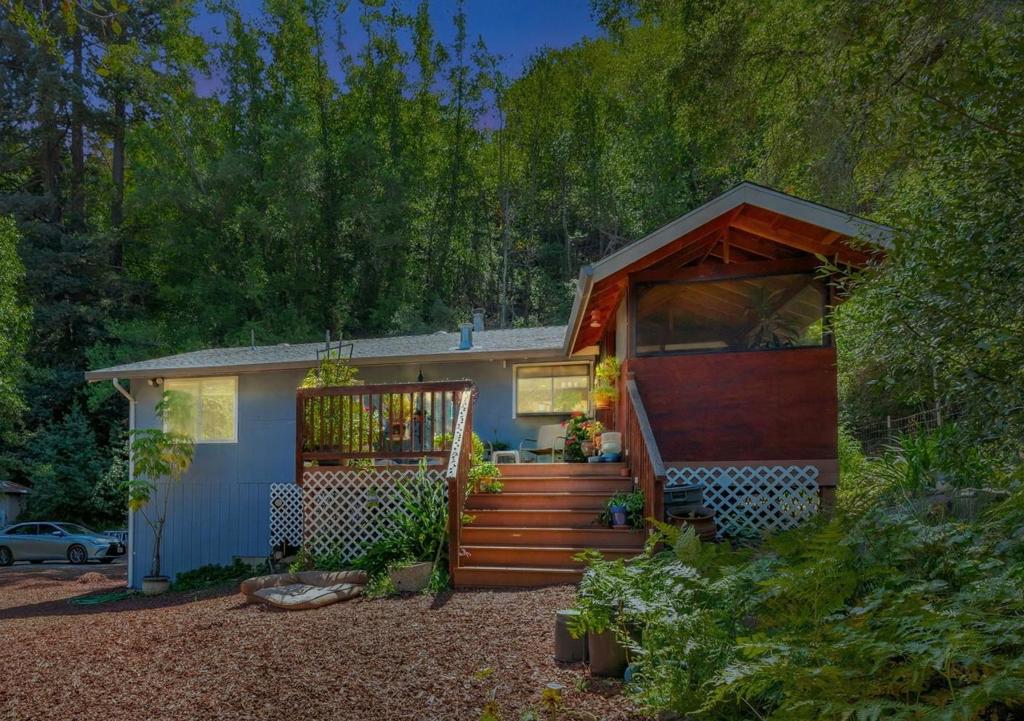 A serene country Home, nestled on 4.5 ac in the shadow of Mt. Madonna! Located in a pastoral setting, a charming 2 bedroom/2 bath Home that is ideal for a weekend retreat or full-time living! For these sellers, it has been a cherished year round home for 30 years! . Entering the Home you pass by an exquisite Fish Pond and gurgling sound. An outdoor entry Trex-type deck is a great place to read in the morning, with a cup of coffee. Entrance is through the "Mud Room," common in many country homes. Vaulted ceiling in the Great Room with a wall of windows, ceiling fans, granite countertops in Kitchen with garden window. The Primary Bedroom has views to wooded mountains and private patio and barbeque area. 4 steps lead from Great Room to the outdoor patio and entertaining area. Springtime wild sweet peas & daisies color the hillside with magic! This has been a horse property with large stall and hot-wired paddock, water & electricity, septic close to the horse area. Possible sunlit ADU homesite, with paths to seasonal creek. Serene and private yet less than 10 miles to town. On the South County Wine Trail, just up the hill from Fernwood Cellars and Martin Ranch Winery. Part of a welcoming country community of homes, on a private road. Make it your next Special Home!!