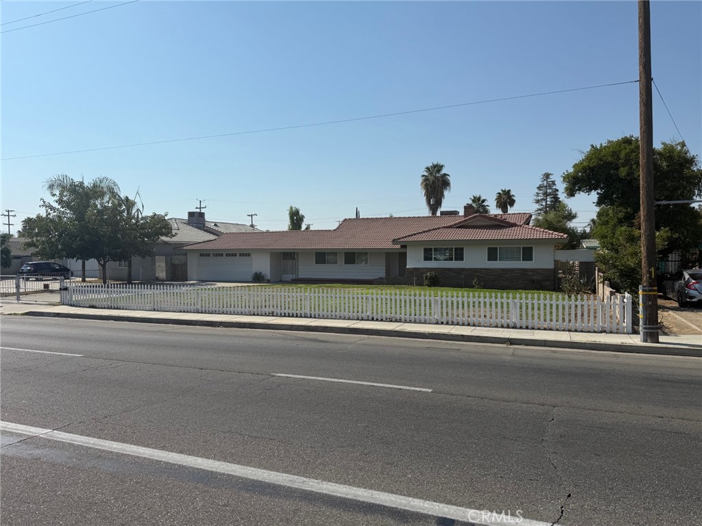 Welcome to this classic newly remodeled Ranch style home located in central Bakersfield. It features tile Roof. Open floor design. 2115 sq ft, 5 Bedrooms, 2.5 Baths, Den, formal dining, split wing. On 14,374 sq ft lot. Spacious great room with beautiful brick fireplace & new French door. Stylish laminate flooring throughout. Gourmet kitchen with quartz countertop, stainless steel appliances & SS sink, garbage disposal, brand new cabinets. Renovated bathrooms, new paint in & out, updated light fixtures, newer HVAC system, new window blinds, new dual pane windows. New ceiling fans in every bedroom. Double vanities in hall bath. The primary bedroom has two closets. Extra-large 2-car garage w/new door & automatic opener. Huge backyard with alley access. Large covered patio w/gas stub perfect for outdoor BBQ & entertainment. Indoor laundry. Block walls at both side yards. Convenient close to shopping, dining, school, park and freeway access.