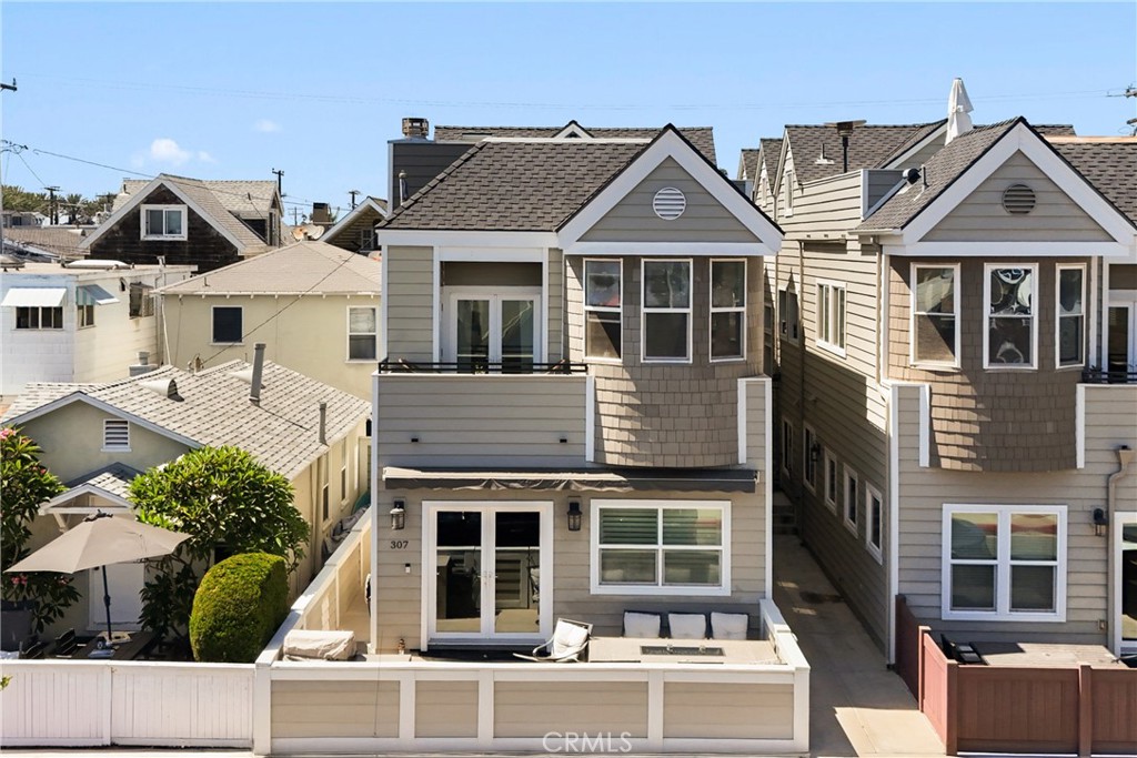 Welcome to this beautiful updated second floor, 2-story condo nestled in the heart of the Balboa Peninsula. Offering 3 spacious bedrooms and 3 bathrooms, an oversized rooftop deck, this coastal retreat combines comfort, style, and an unbeatable location; with one bedroom and bathroom conveniently on the first level. Enjoy open concept living with a balcony right off the living room to soak up the ocean breeze and peak-a-boo ocean view. Extras include a one car garage with a carport and in unit washer and dryer for convenience. Just steps from the sand and surf and walking distance to the areas best restaurants, coffee shops, and local hotspots; this home perfectly captures the essence of coastal living.