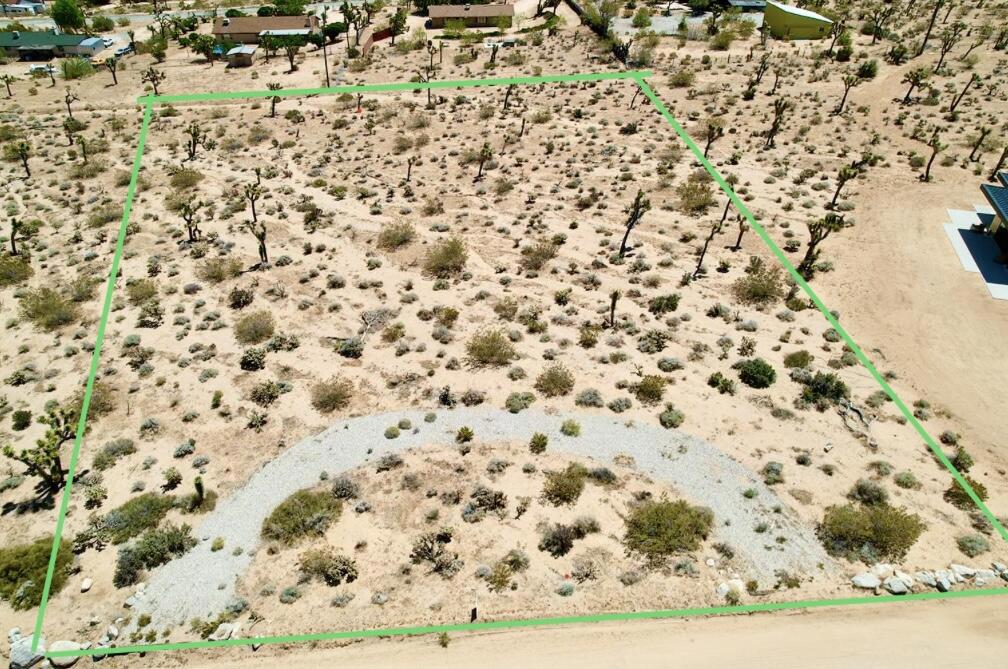 1.25 ACRE LOT, ready for you to build your dream oasis! Immediate access to utilities on street. Minutes away from the west entrance of JTNP. Build your dream set up with stunning views with panoramic views of the desert landscape, including vibrant sunsets & star-studded night skies. Short term rentals are allowed in San Bernardino County. Buyers to investigate and confirm the county requirements. Information deemed reliable but not guaranteed. Zoning: Joshua Tree/Single Residential -1 Acre Minimum - APN: 0602-151-02-0000- Call 760-401-5309 with questions & interest.