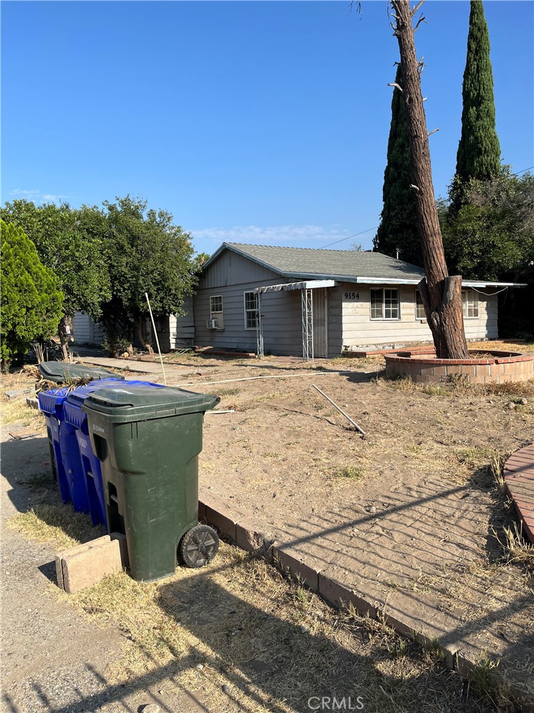 Home on over 1/2 acre in city, with your own paved road leading to the front and back house and a storage building. 6 year old new roof with kitchen remodeled 6 years ago but brand new Range to be installed. 2 new bathroom with new toilets and shower enclosure. All new water line installed. over $40K in recent upgrades New paint, new flooring. over 1/2 acre in city with tons of potential. gated entry. Live in one and collect rent on the other. (front has 3 bedrooms plus bonus) with 1 bath. the back has 2 br 1 ba. New kitchen, new range, new paint, new flooring. no garage but plenty of parking, special tax only $447/year