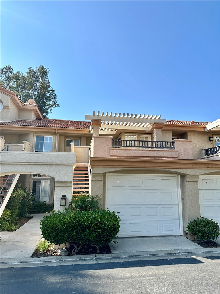 LOCATION, LOCATION, LOCATION! Spacious 1 bedroom condo in the desirable Las Ventanas community. Well maintained second floor unit. Living room with cozy stone fireplace and high ceilings, kitchen with granite counter top, in-unit washer and dryer, loads of closet space, two vanities, large covered patio, and separate balcony. Unit comes with an attached 1-car garage plus one assigned carport space. Well-kept gated neighborhood features community pool, spa, and clubhouse. Great location across the street from Granary Square and close proximity to shopping, restaurants, Henry Mayo Hospital, schools, and freeway access. Come and see it today!