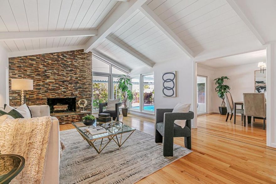 Located in the highly sought-after Golden Triangle neighborhood with access to top-rated Saratoga schools, this home offers a versatile and inviting floor plan. The main level features four bedrooms, including a spacious primary suite. Upstairs, an oversized bonus room with its own bathroom provides endless possibilitiesperfect for a game room, office, or family retreat. The living room is light-filled and airy, with vaulted ceilings, floor-to-ceiling windows, and a custom stone fireplace. The gourmet kitchen, gleaming hardwood floors, skylights, recessed lighting, dual-pane windows, and elegantly updated marble bathrooms showcase both style and comfort. Fresh interior and exterior paint add a move-in-ready touch. Outdoor living is equally impressive, with a swimming pool, cabana with bathroom, multiple garden beds, and a newly carpeted covered patio ideal for entertaining or relaxing. One of this propertys most unique features is direct access to Congress Springs Park, offering a natural extension of your backyard with endless recreation.