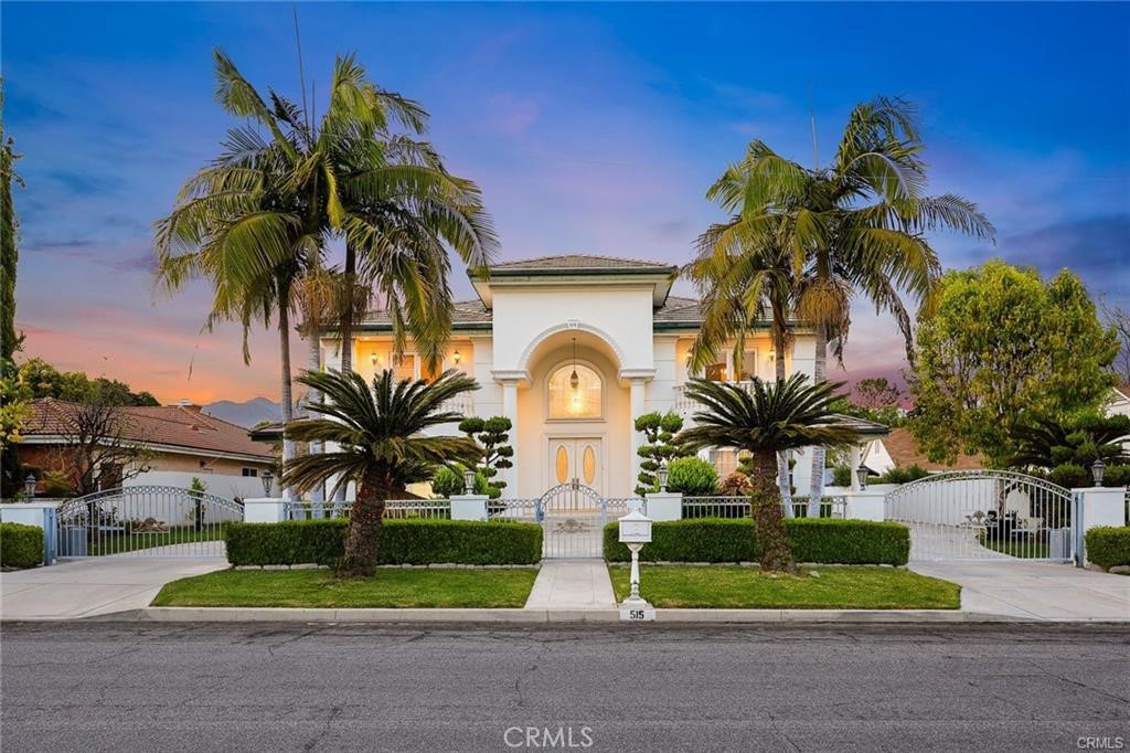 Welcome to this luxurious custom-built home located in one of Arcadia’s most prestigious neighborhoods. Sitting on a nearly 20,000 sq.ft. lot, this south-facing estate offers 7 en-suite bedrooms, 8.5 bathrooms, and approximately 6,654 sq.ft. of refined living space designed for both comfort and grandeur. Upon entry, you are greeted by a soaring high ceiling adorned with a magnificent crystal chandelier, setting the tone for the sophistication throughout. The spacious formal living room with a cozy fireplace flows seamlessly into the elegant formal dining room—perfect for entertaining and family gatherings. The open-concept kitchen is a chef’s dream, equipped with professional-grade appliances, a large center island, and a bright breakfast area. Adjacent to the kitchen is a warm and inviting family room featuring a wet bar and French doors that enhance natural light and indoor-outdoor flow. The main level includes 2 en-suite bedrooms, a library/home office, and a stylish powder room. Upstairs, you’ll find 5 additional en-suite bedrooms, including the expansive primary suite with its own fireplace and French doors leading to a large private balcony. Step outside into a true backyard oasis—complete with a resort-style swimming pool and spa, perfect for both entertaining and everyday relaxation. The lush landscaping provides tranquility and privacy, making this outdoor space a personal retreat. Additional highlights include excellent natural light throughout, high-end finishes, and a thoughtfully designed layout ideal for multigenerational living. Located within the top-rated Arcadia Unified School District and close to parks, dining, shopping, and entertainment. Don’t miss the opportunity to own this exceptional Arcadia estate—schedule your private tour today!