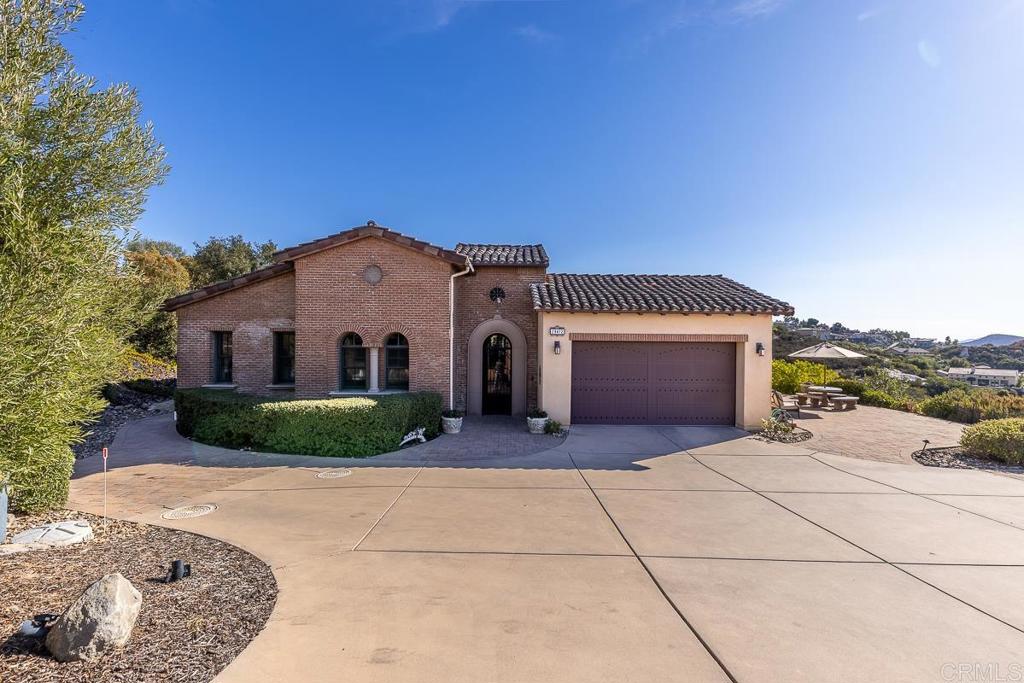 Value range Price $1499,900-$1,550,000 single story Mediterranean style home located in the prestigious private gated guard security community of Rim Rock Estates. This semi custom dream Home offers upscale amenities. As you drive up you will be greeted with this homes elegance and charm. When entering the custom iron gate it leads you to the breezeway and wall fountain as you continue through the private courtyard. New HVAC system, newer water softner Grounds are beautifully landscaped with low maintenance landscaping and artificial lawn in backyard landscaping includes drought tolerant plants, fruit trees and fruitless olive tree. Breathtaking Panoramic views of Mountains and Catalina Island. Enjoy the several patios spaces home offers allowing different areas to enjoy incredible sunsets. Home offers an open floor plan concept with a chefs kitchen includes stainless steel Thermador and kitchen aid appliances, custom cabinetry and built in refrigerator. The great-room offers soaring ceilings with painted glass windows, hardwood floors, and porcelain tiles. There are two log burning fireplaces, one in master, the other in great room. This house is located on 2.5 acres large plentiful windows, plantation shutters and spacious layout that lets the light flow. The dining room includes French doors leading to private backyard patios offer interlocking pavers. Master has a large walk in closet master includes travertine shower enclosure, large tub, his/her sinks, walk-in shower with his/her nozzles, as well as French doors leading to exterior patio with interlocking pavers. Separate wing has three additional bedrooms with two full baths.
