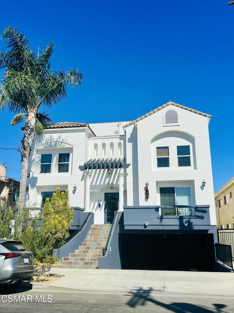 Welcome home to beautiful Valley Village! As you enter this unit you will find an open floor plan with floor to ceiling windows, hardwood floors, freshly painted walls and cabinets, a fireplace, kitchen w/bar top, and a guest bathroom. The kitchen also features a refrigerator that isn't currently pictured. As you make your way to the second floor you will find 2 high ceiling master bedrooms with private full bathrooms, walk in closets, and hardwood floors throughout. The in unit washer and dryer are also tucked away behind double doors on the second floor. As you make your way up to the 3rd floor you will find your own private rooftop deck with plenty of space for a bbq, lounge chairs, and beautiful views of the neighborhood. This private space is perfect for a cozy night watching the sunset or entertaining friends and family! You have two shared walls but no one above you! The unit also features a gated garage with 2 tandem parking spots with guest parking available. This townhome is vacant and move in ready in the heart of valley village near restaurants, bars, the studios, shopping and more!