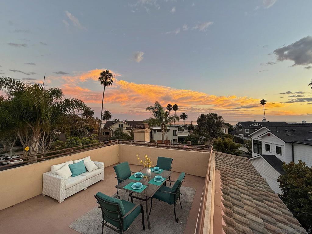 California Coastal Elegance – Just Steps from Coronado Beach. Welcome to this stunning California classic, originally constructed in 1959, reimagined with a major remodel in 2001, and thoughtfully upgraded by the current owner in 2016. Located just steps from the Pacific Ocean, this spacious and private residence offers the very best of coastal living, with 173 feet of rare street frontage — more than double the average in the area. From the moment you enter the gated courtyard, this beautifully rebuilt home welcomes you into a serene retreat that seamlessly blends timeless charm with modern amenities. Inside, you'll find five bedrooms and five baths, including an attached studio, private office, or ADU with its own entrance and full bath. A grand, curving wrought iron staircase leads to an upper-level family room complete with a wet bar and mini fridge — perfect for entertaining or relaxing. The generous master suite features a double-sided fireplace and a spa-inspired en suite bathroom. Enjoy panoramic ocean views from the sun-drenched rooftop deck, an ideal spot for watching sunsets or 4th of July fireworks. The gourmet kitchen includes stainless steel appliances and high-end granite countertops, while multiple entertainment areas — including a wrap-around patio with a cozy fire pit — offer endless opportunities for indoor-outdoor living. Whether you're hosting guests or enjoying quiet evenings by the sea, this exceptional home has it all. Bring your most discerning buyers — this is a true Coronado gem.