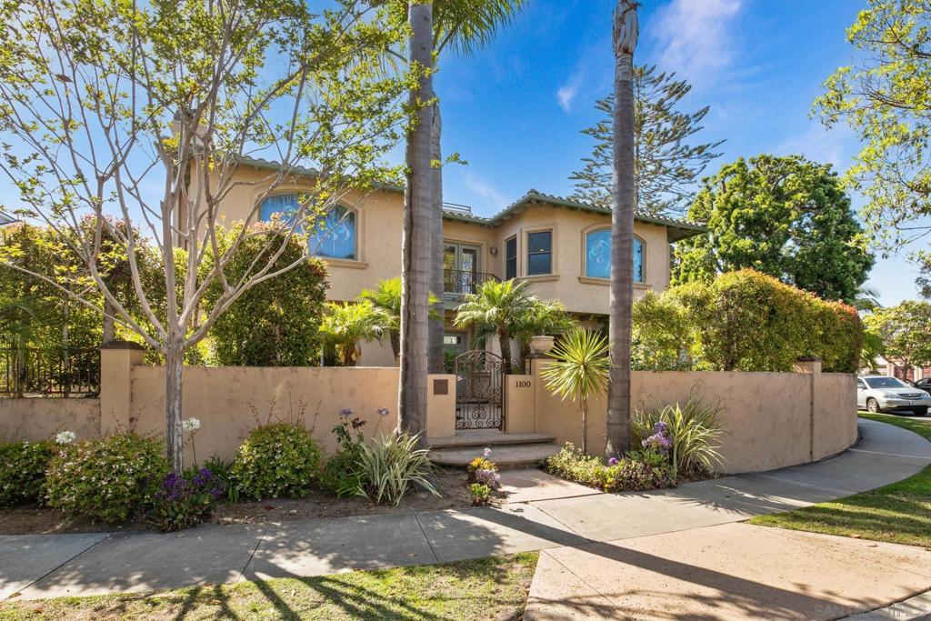California Coastal Elegance – Just Steps from Coronado Beach. Welcome to this stunning California classic, originally constructed in 1959, reimagined with a major remodel in 2001, and thoughtfully upgraded by the current owner in 2016. Located just steps from the Pacific Ocean, this spacious and private residence offers the very best of coastal living, with 173 feet of rare street frontage — more than double the average in the area. From the moment you enter the gated courtyard, this beautifully rebuilt home welcomes you into a serene retreat that seamlessly blends timeless charm with modern amenities. Inside, you'll find five bedrooms and five baths, including an attached studio, private office, or ADU with its own entrance and full bath. A grand, curving wrought iron staircase leads to an upper-level family room complete with a wet bar and mini fridge — perfect for entertaining or relaxing. The generous master suite features a double-sided fireplace and a spa-inspired en suite bathroom. Enjoy panoramic ocean views from the sun-drenched rooftop deck, an ideal spot for watching sunsets or 4th of July fireworks. The gourmet kitchen includes stainless steel appliances and high-end granite countertops, while multiple entertainment areas — including a wrap-around patio with a cozy fire pit — offer endless opportunities for indoor-outdoor living. Whether you're hosting guests or enjoying quiet evenings by the sea, this exceptional home has it all. Bring your most discerning buyers — this is a true Coronado gem.