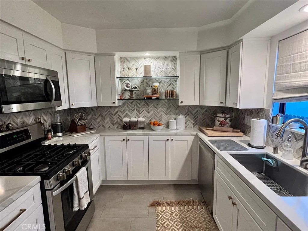 Discover style and comfort in this beautifully updated one-bedroom, one-bath condo featuring a remodeled full kitchen, spacious living area, expansive bedroom with large walk-in closet, new HVAC and in-unit washer and dryer. The expansive private patio is perfect for relaxing or entertaining. It is a serene retreat while still being just moments from all that Studio City has to offer. Enjoy the abundant natural light, and a layout that lives large in a small pet friendly HOA with earthquake insurance, good maintenance and gated two car tandem parking already wired for your EV. Just one block from The Shops at Sportsmen’s Lodge, across from the walk along the River and in close proximity to Ventura Blvd's dining and shops, this condo is an ideal urban haven. Don’t miss this incredible opportunity to live in a peaceful, spacious, and stylish home in one of LA’s most sought-after neighborhoods.