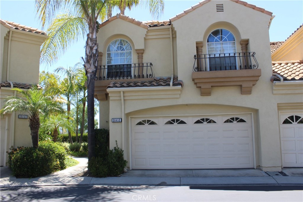 Awesome, one of the best locations in the community views of park, home overlooking lots of green grass feels very private and serene, and gated community and pool inside gate. Three bedroom two story townhome with open bonus or play room at the top of the stairs. Formal living room with fireplace, dining room, separate family room with fireplace and views, eating area off family room and kitchen area, upgraded granite counters in kitchen. Marble entry,1/2 bath downstairs, this is an end unit (really only one neighbor to the right) great yard and patio for entertaining. Large master suite with large bathroom and dual sinks, separate shower and large tub, views from the bedroom also. Other two bedrooms and bathroom are on the other side of the master bedroom, mirrored wardrobes, fans in most rooms. Beautiful Formal living room has fireplace and family room has fireplace also. Tons of windows and very high ceilings make this property very light and bright. And laundry is upstairs-perfect!