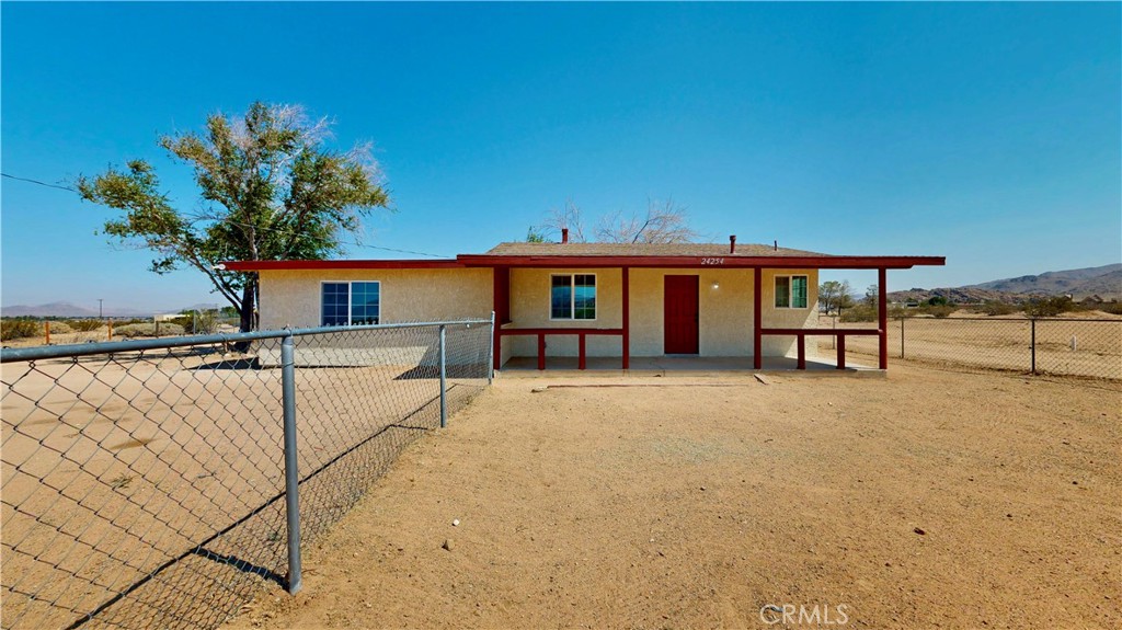 Bring your horses, your toys, and your dreams to this beautifully remodeled 3-bedroom, 2-bathroom home sitting on a sprawling 7.7 ACRE LOT. Remodeled approximately four years ago, the home features an open-concept kitchen with modern cabinetry and granite countertops — perfect for cooking and entertaining. Both bathrooms have been tastefully updated with stylish tiled showers and new vanities, while tile flooring runs throughout the entire home for a clean and cohesive look. Relax and take in breathtaking desert sunrises from the covered front porch. The property is on well water and propane — offering self-sufficiency and space to grow. Don't miss this unique opportunity to own a piece of the desert with room to roam!