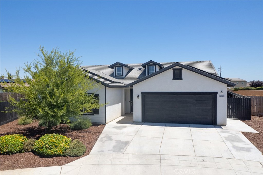 Built by Carmel Homes in 2022, this beautifully maintained single-story home offers 4 bedrooms, 2 bathrooms, and a spacious open-concept layout. The heart of the home features a modern kitchen with a large island, walk-in pantry, and seamless flow into the living area—perfect for entertaining or everyday living. Enjoy energy efficiency with an owned solar system and a tankless water heater. Situated on an oversized lot, the backyard is ready for your vision with plenty of room for a pool. Outdoor upgrades include extended concrete patio space, a walkway to a custom pergola, and additional side yard concrete for added function. Conveniently located near Madera South High School and Highways 145 and 99, this home offers easy commuting while maintaining a quiet neighborhood feel. A fantastic opportunity to own a better-than-new, move-in-ready home with room to grow! Contact your realtor for a private showing today.