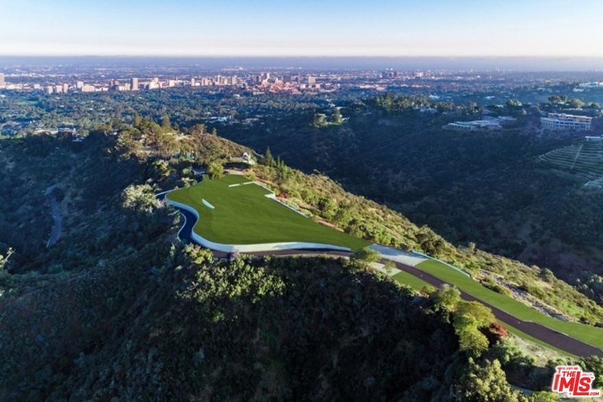 The Enchanted Hill, a 120 acre undeveloped site in Beverly Hills, offers a rare opportunity to develop a single-family compound with multiple guest homes, a state-of-the-art fitness and wellness center, an entertainment complex, a sports arena, world-class equestrian facilities and winery or to subdivide and redevelop as Beverly Hills' greatest modern gated community with the same amenities. Purchased in 1997 by the late Paul G. Allen, Microsoft co-founder and philanthropist, the property has undergone extensive infrastructure improvements including a one-mile private street, the necessary utilities, and two separate gated entrances, on Benedict Canyon Drive and Angelo Drive. Just minutes from Rodeo Drive and The Beverly Hills Hotel, the iconic hilltop property hovers high above the city, offering unrivaled 360 degree views from downtown to the ocean, with unlimited privacy. Truly the last of its kind.