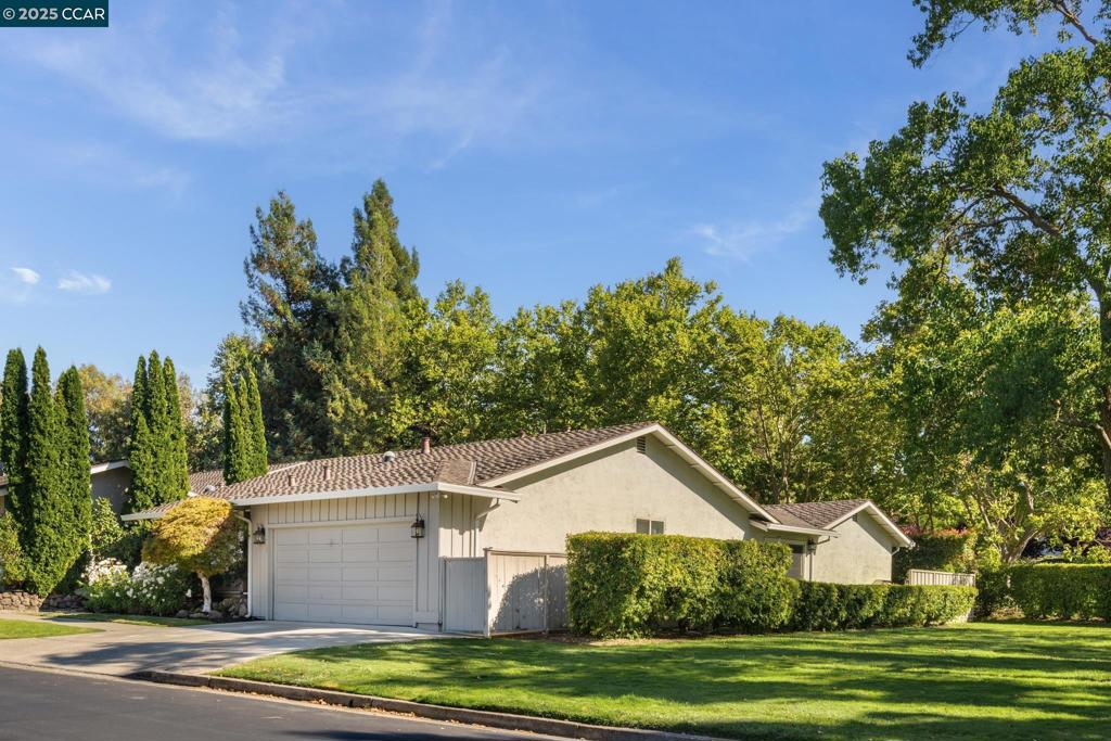 Beautifully remodeled and highly sought-after, this single-level Scottsdale model enjoys a premium location alongside a lush greenbelt in Crow Canyon Country Club. Flooded with natural light, the home showcases vaulted ceilings, elegant crown moldings, and brand-new French oak hardwood flooring throughout. At the heart of the home is a spectacular new gourmet kitchen featuring custom cabinetry, quartz countertops, top-of-the-line stainless steel appliances with hooded range, designer lighting, a large center island with seating for four, and a striking custom backsplash. An adjacent wet bar enhances the home’s perfect balance of style and functionality. Offering four spacious bedrooms and two-and-a-half beautifully updated bathrooms, the layout provides both comfort and flexibility. Outdoors, enjoy an expansive private patio and yard—perfect for entertaining or simply relaxing in a serene setting. A true turnkey opportunity in an ideal location close to the gate, clubhouse, and all the amenities that make Crow Canyon Country Club living so desirable.