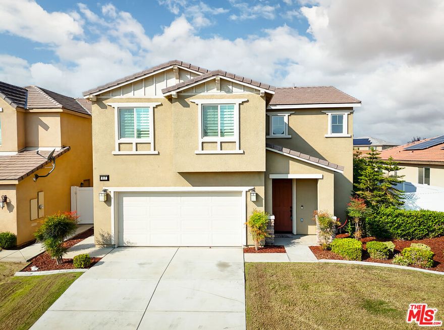 This immaculate two-story home is truly move-in ready, featuring fresh new paint throughout. The first floor offers a spacious open layout with a large kitchen boasting granite countertops, stainless steel appliances, and a generous island with breakfast seating that flows seamlessly into the expansive great room. A convenient powder bath completes the main level.Upstairs, you'll find four bedrooms and two full bathrooms, including a large master suite with a luxurious en-suite bath featuring dual vanities with quartz counters, a walk-in shower, and a walk-in closet. Three additional well-sized bedrooms, a full guest bath, and an indoor laundry room provide functionality and comfort for the whole family.Outside, enjoy a beautifully landscaped backyard with vinyl fencing and a covered patio  perfect for relaxing or entertaining. This home also includes a fully owned solar system to offset rising utility costs and a 50 AMP outlet for RV hook-up.Just a short walk away, you'll find the community pool, park, BBQ area, and playground.