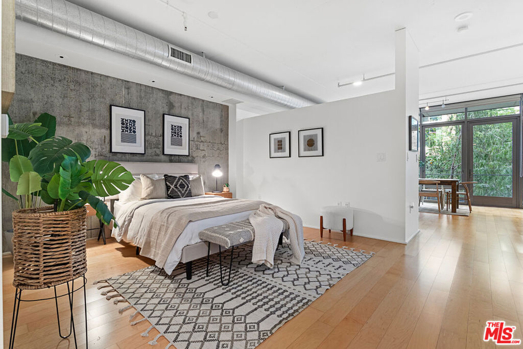 Summer in the City Meets Peaceful Green Retreat. Experience the best of downtown living in this 1-bedroom, 1-bath loft at the sought-after Luma South Lofts. South Park's premier mid-rise in the heart of vibrant Downtown LA. With 917 sq. ft. of bright, open living space, soaring ceilings, and an entire wall of floor-to-ceiling windows, this home blends style and comfort seamlessly. Step onto your rare private balcony and enjoy serene views of lush treetops and the sparkling pool. A refreshing, resort-style escape that feels worlds away from the city bustle. The greenery, open sky, and inviting pool deck create the perfect summer-ready retreat right outside your door.Inside, you'll find a spacious walk-in closet, a large bath, and the convenience of in-unit laundry. Luma South Lofts is LEED Gold-certified and impeccably maintained, offering 24/7 concierge & security, a modern fitness center, spa, pool, and sundeck with multiple grills for warm-weather gatherings. With secure garage parking, major utilities (except electricity) included in the HOA, and a location just steps from Whole Foods, LA Live, Crypto.com Arena, Target, Zara, and top dining destinations this is downtown living at its most vibrant. Don't miss this opportunity ready for its next tenant.