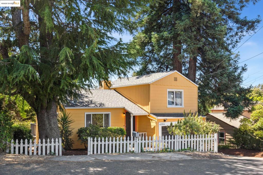We welcome you to visit this peaceful retreat nestled on a quiet cul-de-sac. This home sits on a large, sun-filled lot with a gorgeous view of the open space in the rear. It's surrounded by redwoods, oaks, and fruit trees including orange, pluot, apricot, and a veggie garden. Inside, hardwood floors and the open layout create a warm, welcoming flow through the living room, dining area, and kitchen. Upstairs are two tranquil bedrooms with lovely views and a tastefully renovated bath. Downstairs, the bonus space is currently used as an office with its own entrance, laundry room, and garage access. This area provides flexibility for working from home, guests, or extra living space. The expansive rear decks allow you to decompress in nature, enjoy a soak in the hot tub, or entertain outdoors with ease. The separate yoga-inspired lower deck offers a peaceful escape and the 16-foot yurt features a skylight and electricity. This is an inspiring space for creative work, movement, or quiet reflection. The garage is perfect for additional storage to keep everything organized. Whether enjoying your morning coffee on the deck, working in the garden, or finding inspiration in the yurt, this home offers a rare opportunity to live surrounded by nature, comfort, and convenience! Views: Ridge