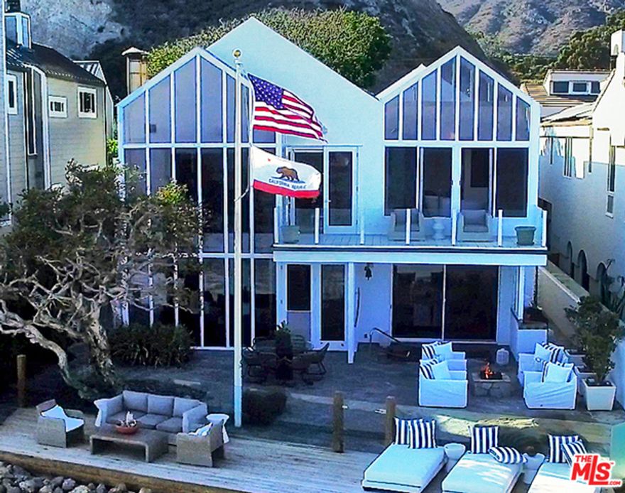 Stunning Malibu beach contemporary on 55 Feet of Beach frontage designed by Architect Ron Goldman. This two-story seaside compound sits on the west end of Malibu Colony Beach, benefiting from the exceptionally deep lots of Malibu Road. With four bedrooms in the main residence and a detached guest suite, this home provides space for a large family looking to have their summertime and weekend beach retreat, or a full time beach estate. In addition, to the large indoor and outdoor living areas, there is also a state of the art Media Room, interior courtyard entry and stunning oceanside patio and decks. This beautiful site also provides views looking down Malibu Colony Beach to the lights of the Queens Necklace beyond and Catalina Island in the distance. For the water enthusiast, Colony Point sits right in front providing a great wave for Surfing and Stand-up Paddle Boarding.