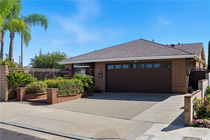 Coastal Charm Meets Modern Comfort

Enjoy the ocean breezes from this beautifully updated 3-bedroom, 2-bath single story home ideally situated on a desirable corner lot just minutes from the beach. Step inside to find fresh interior paint, wood-like flooring, and soaring ceilings that create an open, airy ambiance. The remodeled kitchen features stone countertops, a connected bar/island area perfect for your morning coffee, and an inviting eat in kitchen that flows seamlessly into the adjacent dining/family room with backyard access.

The living room offers warmth and character with its custom stone fireplace and elegant mantle. The spacious primary suite opens through a sliding door to a private covered patio, providing a peaceful retreat. Both bathrooms have been stylishly remodeled with designer tile and accents, upgraded vanities, hardware, and lighting. Additional highlights include a separate laundry room, a gated front courtyard with a spacious grassy area, A/C, newer windows, solar and a custom high-end patio cover complete with an electric shade and lighting—perfect for entertaining or relaxing year-round.