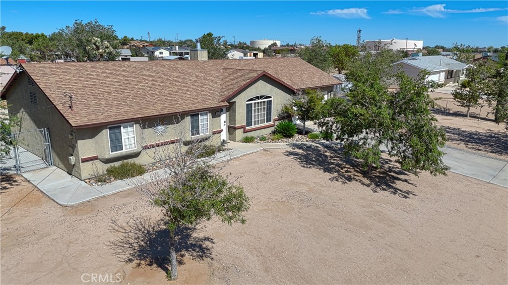 Located in Hesperia with sweeping mountain views, this home was built in 2000 and offers a comfortable, inviting atmosphere. Inside, you’ll find three spacious bedrooms and two well-appointed bathrooms. The living areas feature upgraded laminate flooring, while the kitchen and bathrooms boast modern ceramic tile. This house is exceptionally well maintained, with annual HVAC servicing for peace of mind.
Outside, the property sits on a fully fenced one-acre lot zoned for horses. There’s an area for RV parking, as well as two storage buildings—ideal for tools and equipment. An electric gate provides security and easy access. The yard is dotted with mature shade trees, and there’s a large, covered patio perfect for outdoor entertaining.
For animal lovers, multiple fenced enclosures accommodate a variety of pets or livestock. One separate area includes a small outbuilding perfectly suited as a chicken coop. This versatile property is ready to welcome both people and animal’s home.