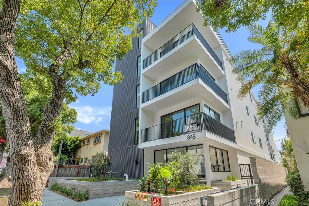 Be the first to live in this brand-new, ground-up construction—a true showstopper located near The Grove. This 1 bedroom, 1 bath unit boasts stunning views, soaring high ceilings, modern finishes, and a spacious open floor plan flooded with natural light. Step into a designer chef’s kitchen featuring custom quartz countertops, a large island with bar seating, stylish backsplash, and brand-new stainless steel Frigidaire appliances—including a refrigerator, stove, dishwasher, and built-in microwave. The primary suite is generously sized with large closets and a spa-inspired bathroom adorned with custom tile work and an elegant vanity. Relax on the huge private patio with gorgeous views, perfect for entertaining, unwinding or having your morning coffee. Additional features include: In-unit washer and dryer, Central A/C Two parking parking spaces, with elevator and stair access. This unit combines luxury living with unmatched convenience in one of LA’s most sought-after neighborhoods. Don’t miss this rare opportunity!