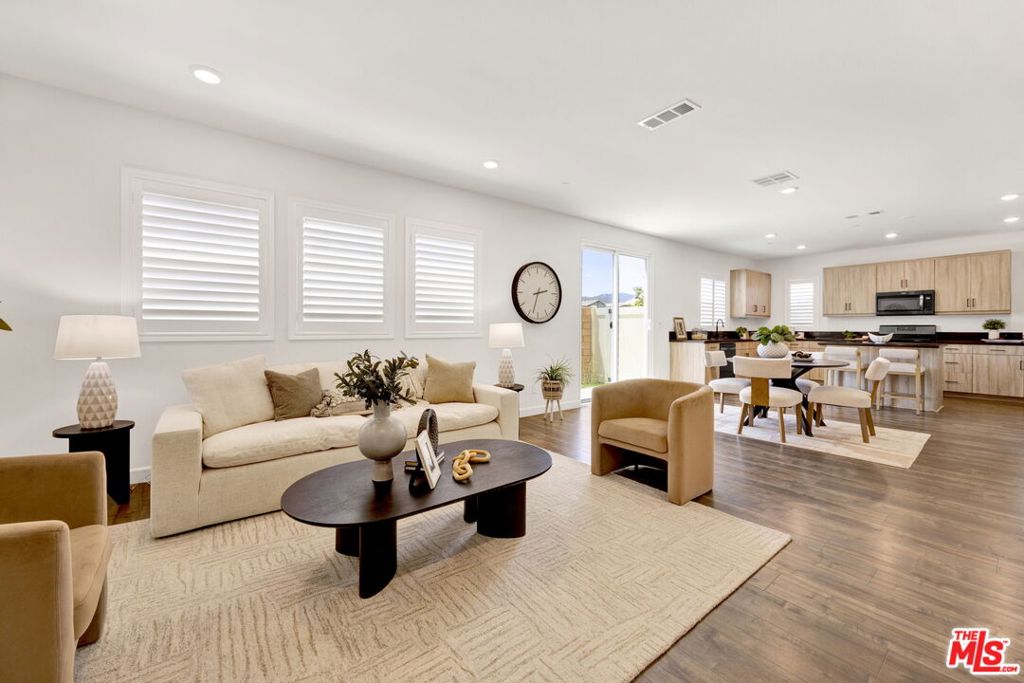 Modern Living in the Heart of Santa Clarita's Vista Canyon -- Experience the perfect blend of luxury, convenience, and resort-style living in this stunning three-bedroom, three-bathroom townhome nestled in the vibrant Vista Canyon community. This contemporary residence boasts a wealth of updated finishes and energy-efficient features, offering an unparalleled lifestyle in one of Santa Clarita's most sought-after neighborhoods.Step inside to discover a thoughtfully designed interior with an open-concept floor plan, ideal for both entertaining and everyday living. The modern kitchen is a chef's dream, featuring sleek countertops, stainless steel appliances, and ample cabinet space. Each of the three spacious bedrooms offers a serene retreat, complemented by three well-appointed bathrooms with contemporary fixtures and finishes.Beyond your doorstep, an array of exceptional amenities awaits. A charming park is situated directly outside your home, providing a picturesque extension of your living space. Across the street, a larger, comprehensive park unfolds, offering a walking trail for leisurely strolls or invigorating jogs, as well as lighted tennis courts for a friendly match.Residents of Vista Canyon enjoy exclusive access to a massive, resort-style swimming pool and a relaxing jacuzzi the perfect oasis for soaking up the California sun. Embracing a commitment to sustainability, this home is equipped with solar panels to help conserve energy and lower utility costs. Further enhancing the property's appeal is a durable and stylish epoxy-finished garage, providing a clean and polished space for your vehicles and storage.This exceptional townhome offers a unique opportunity to enjoy a dynamic and amenity-rich lifestyle within a meticulously planned community. With its prime location, modern features, and unparalleled recreational facilities, this Vista Canyon residence is the epitome of sophisticated Southern California living.